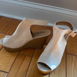 Tan suede like wedge sandals.